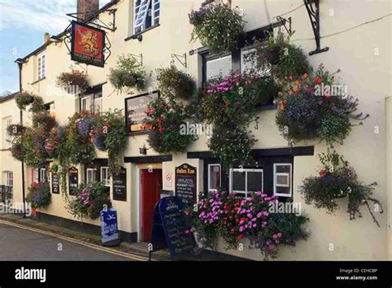 Traditional English Pub, The Golden Lion, With A Charming Exterior And Hanging Flower Baskets The Last Of England: A 21st Century Crawl Through The Country S Town And City Pubs